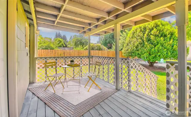 Covered back porch offers a private retreat in every season