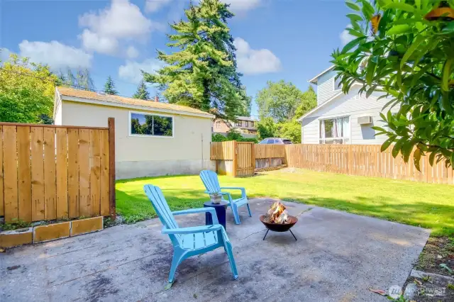 Room to relax and entertain by the fire pit area in the backyard