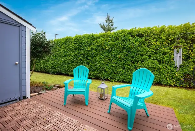 Open patio with privacy hedges