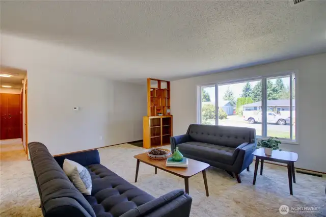 Living room looking towards front door and Maple St.