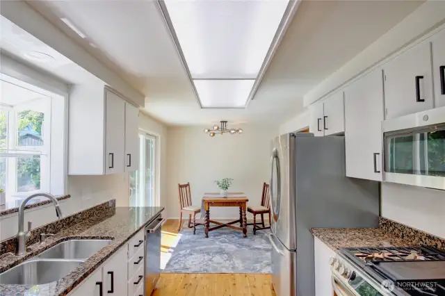 Kitchen with new range, stainless appliances.