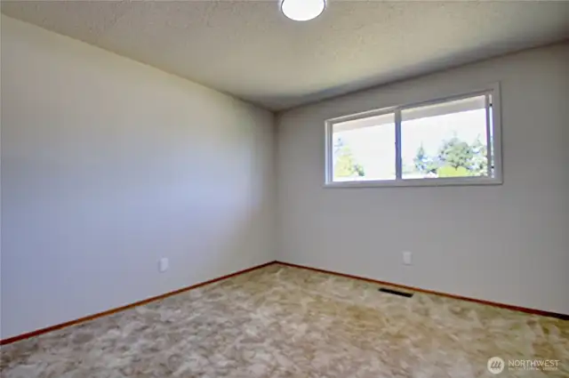 2nd bedroom facing the backyard.