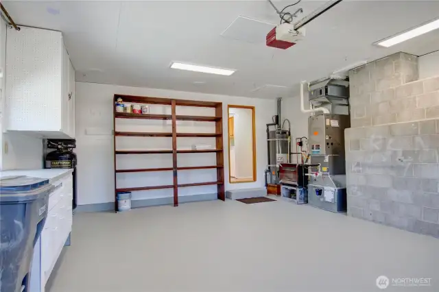 Garage is ready for your projects, freshly painted.  Gas hot water heater, gas furnace & small gas stove for cozy nights in the garage during the winter.