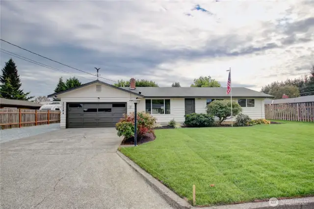 View from front driveway and extra parking on the left.