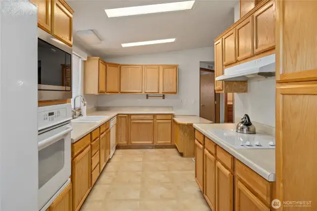 Thoughtful Kitchen set up with wall oven & microwave.