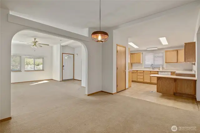 View from the dining room looking at living and kitchen areas.