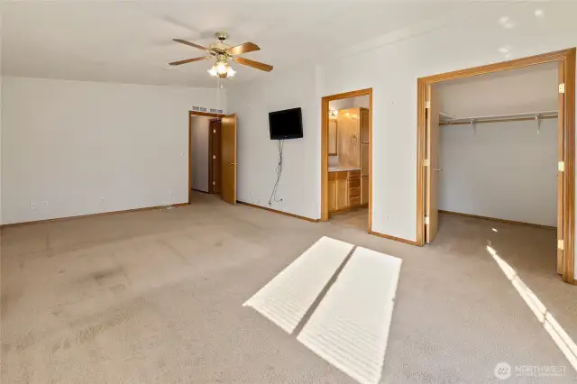 Primary bedroom with walk in closet and private bathroom.