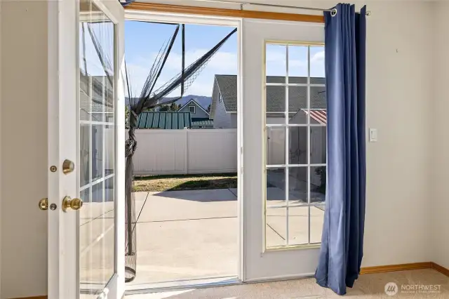 French doors open to large patio space.