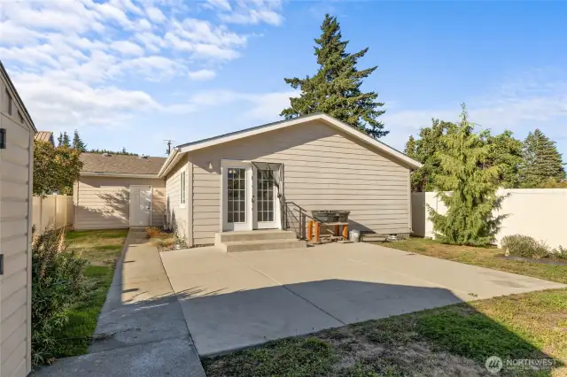 Large patio and easy paved access to the garage.