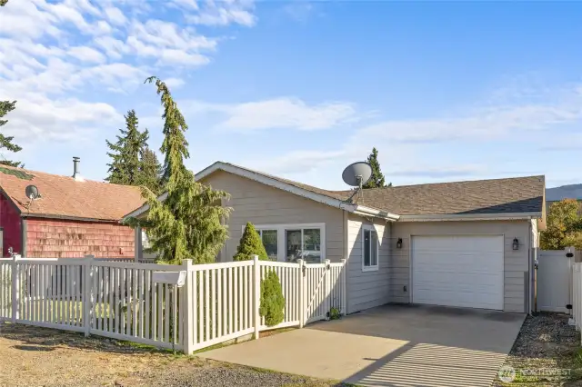 Front view of home with garage and driveway.