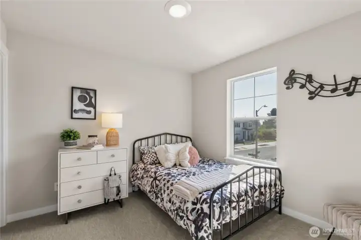 Two of three upstairs bedrooms, this one has a walk in closet!