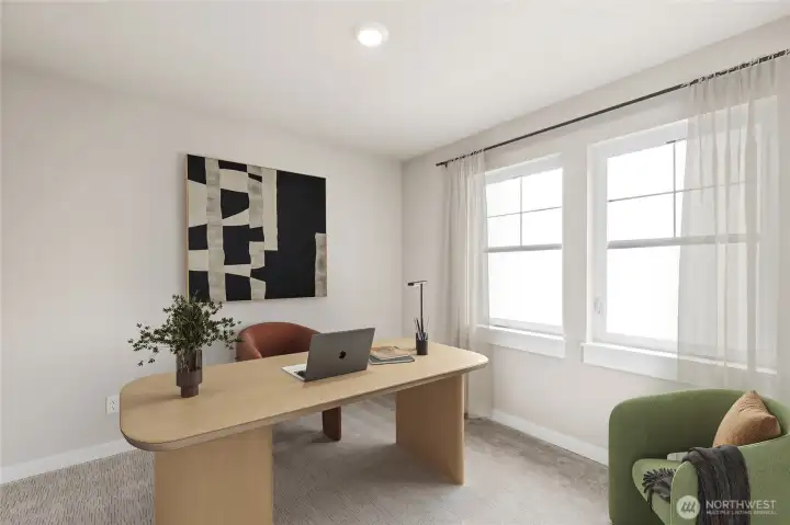 Showing the bedroom upstairs used as an office, virtually staged.