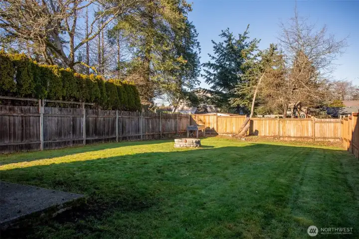 Another view of the Huge Level Backyard that is completely fenced.