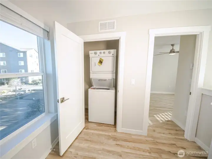 Upstairs utility closet.  Hard floors on second level is a new standard feature. *Previous build