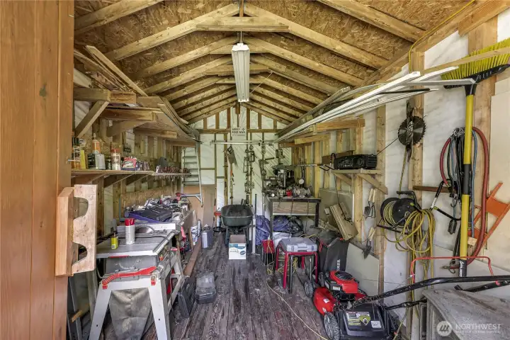 Large shed/shop with lots of space for storage or covered working area.
