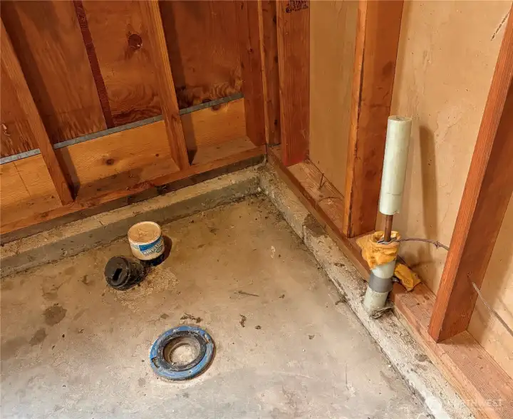 Water/Sewer access in corner of garage.