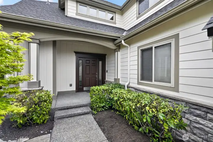 Gorgeous landscaped entry and a front door that has classical and sophisticated appeal.