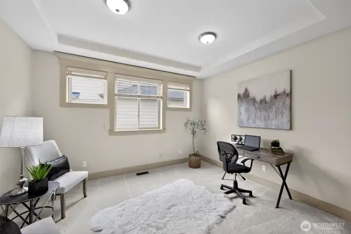 Just off the entry and through the beautiful French doors is the thoughtfully designed office with architectural details.