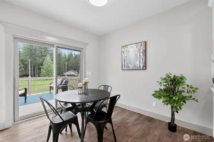 Sunny eating nook opens to an inviting, entertaining patio, creating desirable indoor-outdoor living! Large sliding doors allow for the beautifully landscaped yard to be a serene back drop for the living spaces.