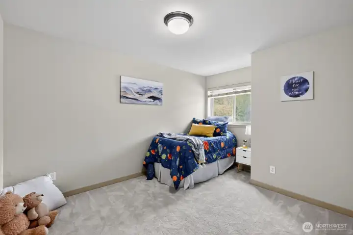 One of 3 spacious, light-filled upstairs guest bedrooms!