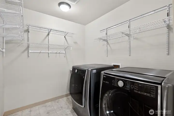 Added convenience: Upstairs laundry room with utility sink makes doing laundry easy & efficient.