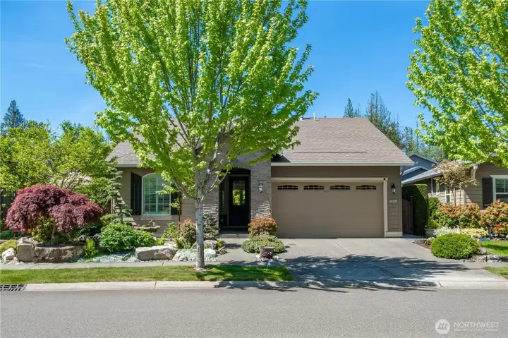 Stunning street appeal greats you with this custom easy-care front yard and stacked stone entryway. A short walk to the Seven Summits Lodge and all amenities!