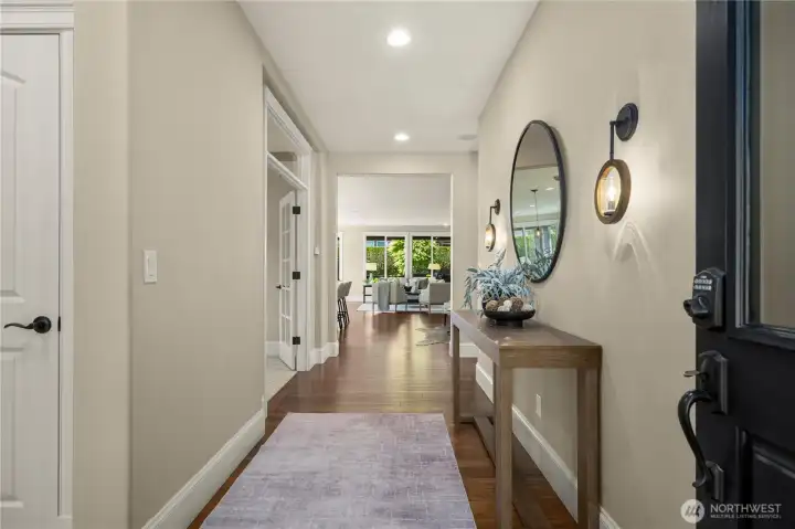 The generous entryway with custom decorative features welcomes you into this stunning home. Expansive Engineered hardwoods, highly upgraded millwork, rounded corners & surround sound throughout.