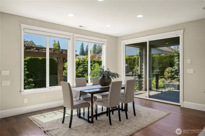 Notice how extremely private all rooms in this home are!  Enjoy dining while surrounded by the natural beauty of your outdoor space. Huge windows (all with custom Hunter Douglas window treatments) allow the SW light to come streaming in!