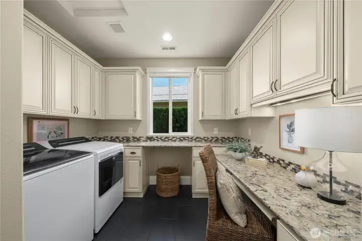 The Smart Space with Quart counters, stunning tile floors, brand new washer and dryer, tone of cabinet/storage space and a convenient desk or craft space.