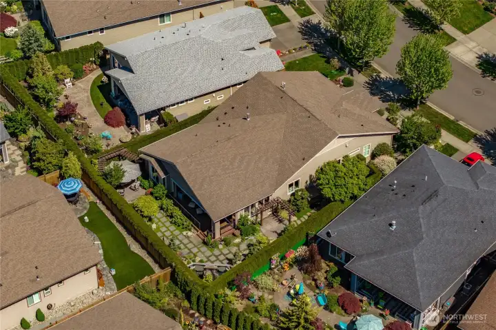 This home has one of the best & private backyards I have seen! The arborvitae hedge, the stunning water feature, the separate cozy area with the firepit, the Azek decking, custom arbors...what else could you ask for?!