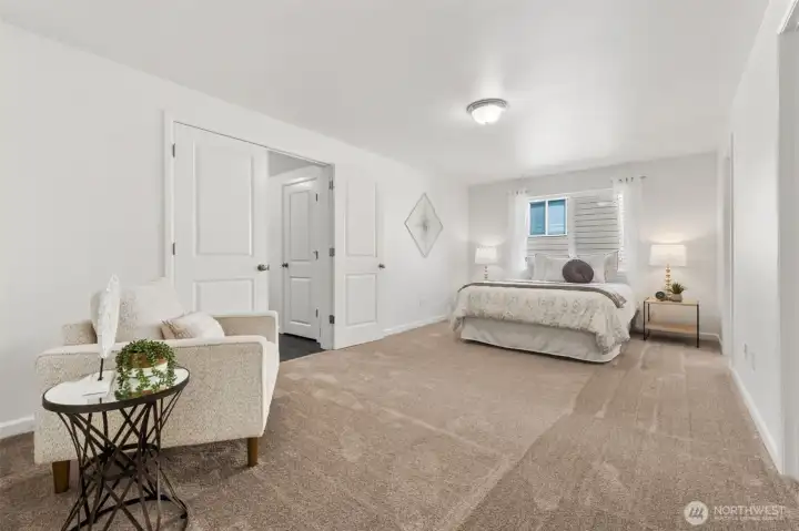 Oversized primary suite with generous space for a sitting area or reading retreat and two closets!