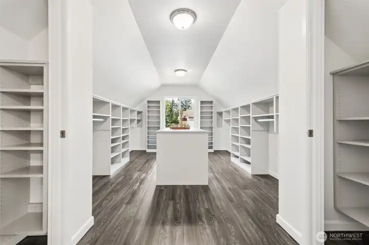 The pièce de résistance — an extraordinary walk-in closet with extensive custom-style storage