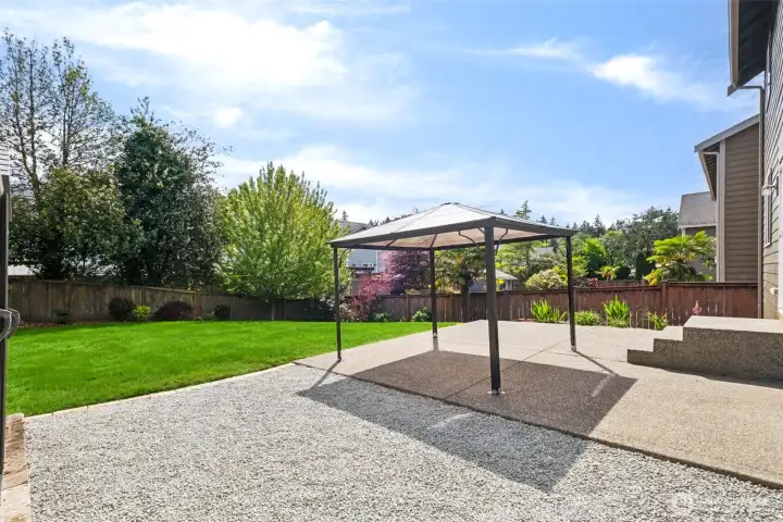 Expansive patio and gazebo create the perfect setting for outdoor entertaining and summer evenings