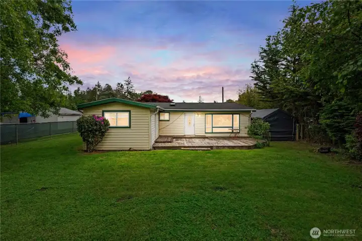 Large backyard with mature landscapes.