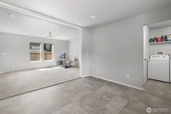 Kitchen into living room and laundry room off kitchen