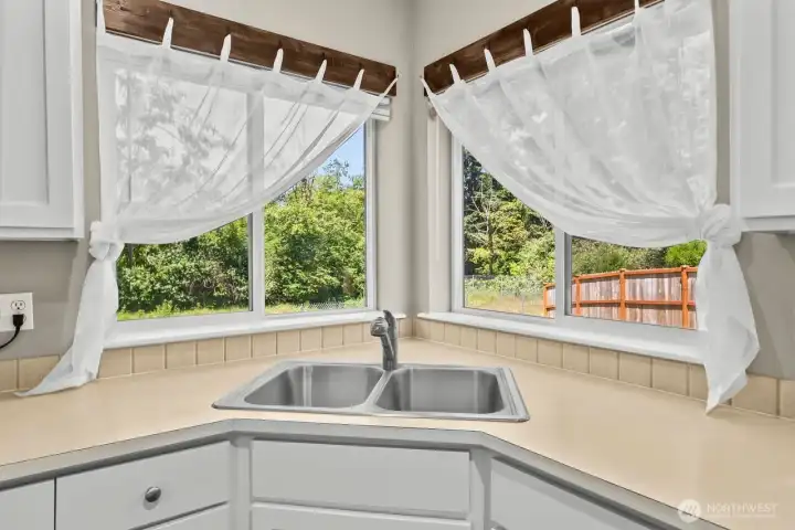 CORNER SINK ALLOWS FULL VIEW OF THE BACK YARD