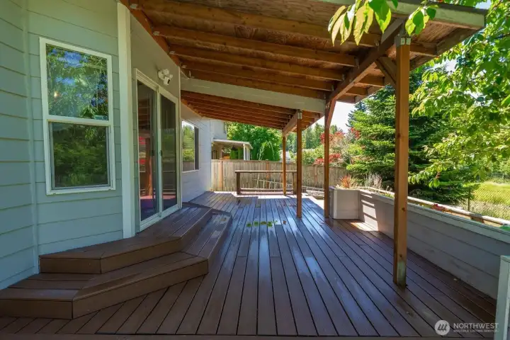 COVERED BACK DECK LOCATED RIGHT OFF THE KITCHEN IS PERFECT FOR ENTERTAINING
