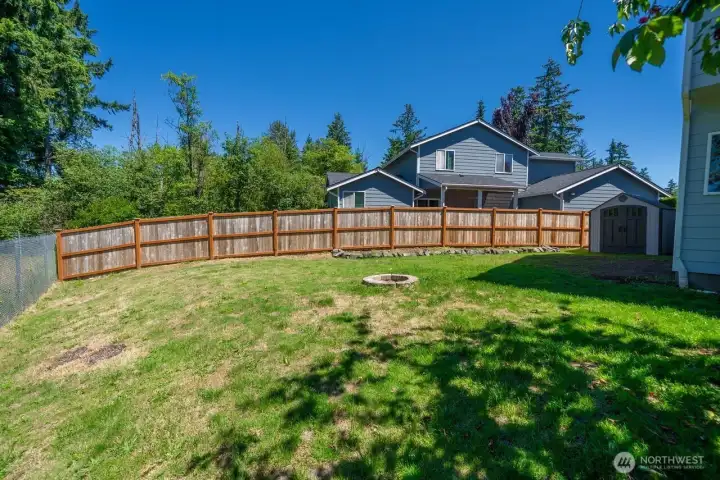 AMPLE SIDE YARD ALLOWS ROOM FOR OUTDOOR GAMES AND SITTING AROUND THE FIRE PIT