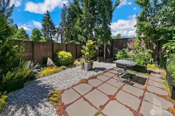 Raised and in-ground garden beds offer space to cultivate vegetables, herbs, and cutting flowers, blending beauty and function in equal measure.