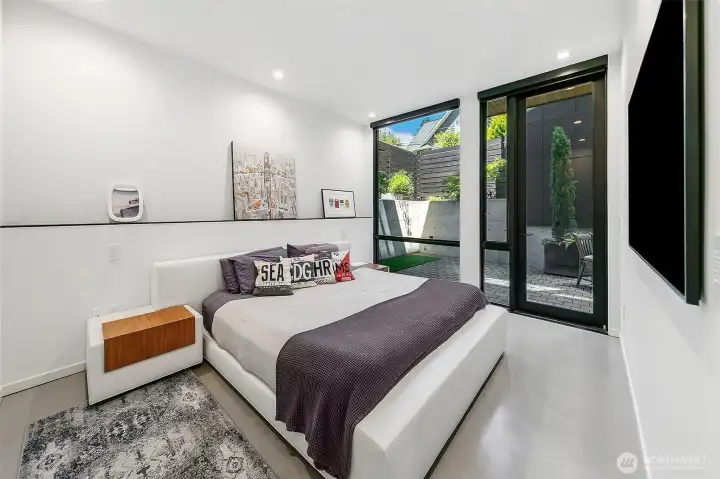 The primary suite is a private sanctuary with a courtyard between the house and garage.