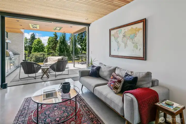 This space also functions as a top floor primary suite with large 3/4 bathroom and expansive balcony.