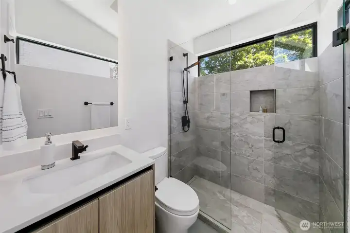 A walk-in-closet leads to this spacious 3/4 bathroom.