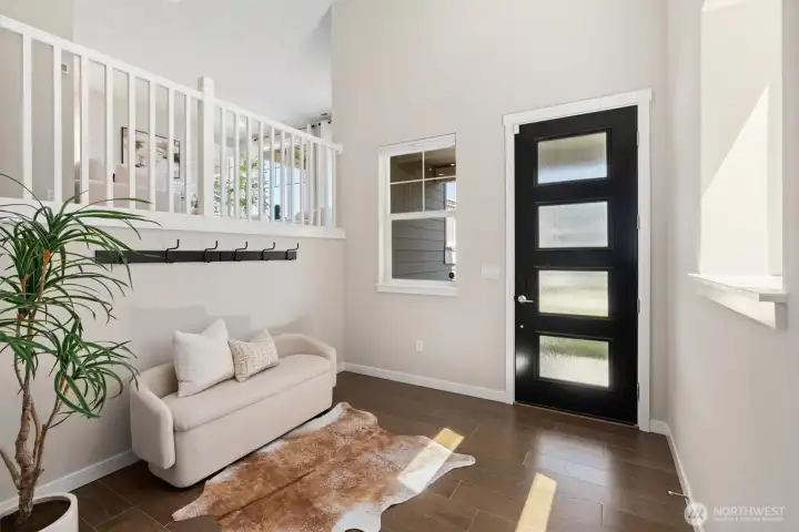 Generous proportions and an open staircase create an immediate sense of space and light.