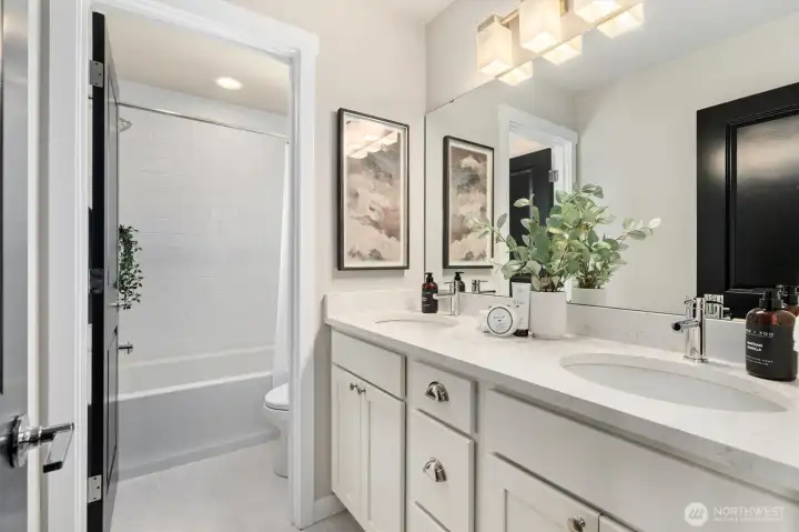 Dual sinks, generous storage, and a separate tub area simplify shared routines.