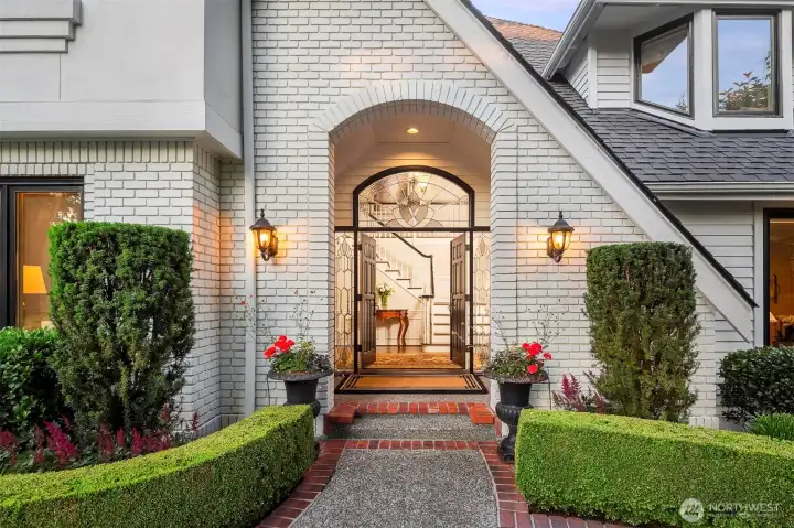 Double front doors with leaded glass sidelights and above doors