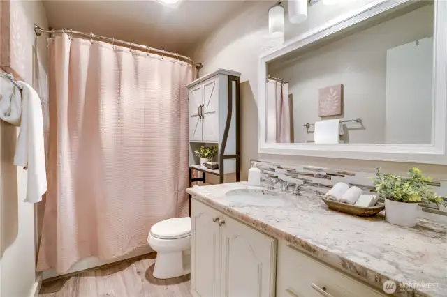 Your private bathroom suite includes a large vanity to prep for the day.