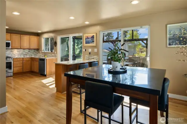 Dining Room w/ its own slider leading out to the massive large covered year round entertaining/living deck area.