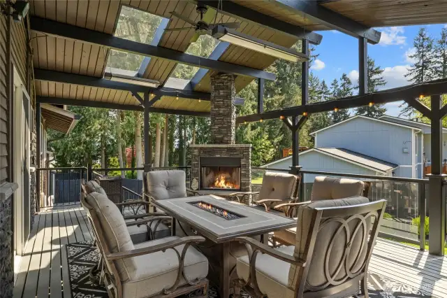 AMAZING back deck year round living/entertaining area! Gas Stone FP, Overhead Gas Heaters, Ceiling Fan, Skylights, Glass Railings and ambience lighting! Mount Rainier VIEW right from your back deck too!!!!