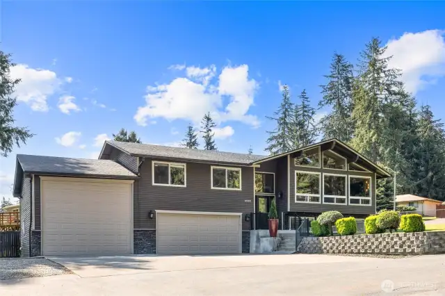 GORGEOUS home love the stacked stone accent and color palette, tons of windows to bring in the Lake Tapps Views and light.