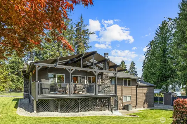 Back of home and that massive back deck perfect for year round entertaining/living! New Heat Pump for Central Air too!